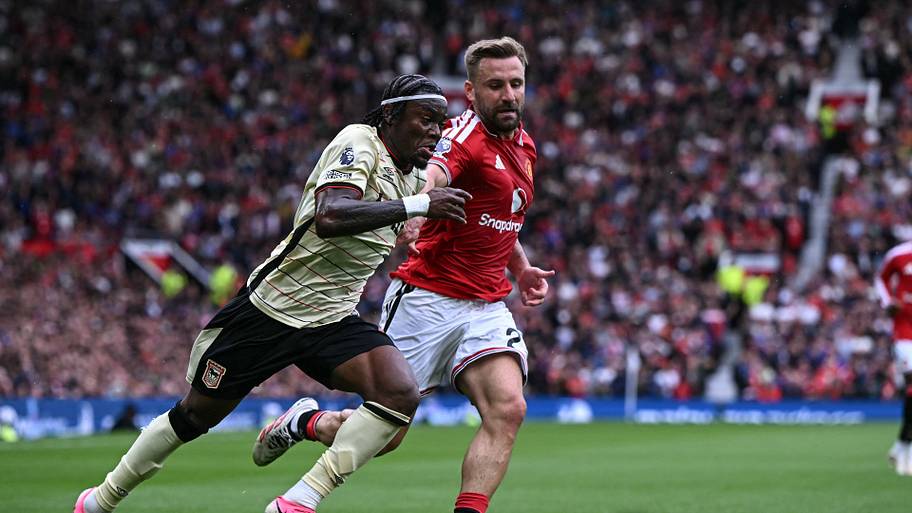 Luke Shaw (right) chasing shadows.