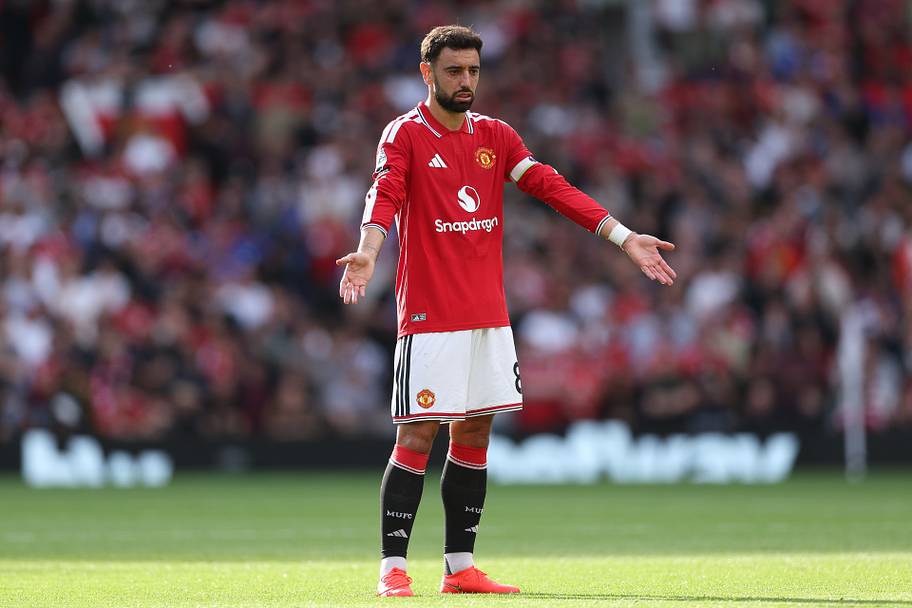 Bruno Fernandes arms outstretched.