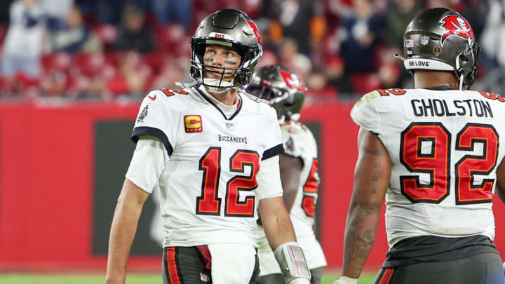 Jan 16, 2023; Tampa, Florida, USA; Tampa Bay Buccaneers quarterback Tom Brady (12) walks off the field in the final minute against the Dallas Cowboys in the fourth quarter during a wild card game at Raymond James Stadium. Mandatory Credit: Nathan Ray Seebeck-USA TODAY Sports