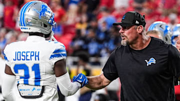 Detroit Lions head coach Dan Campbell shakes hands with safety Kerby Joseph (31) during warm-up at Arrowhead Stadium in Kansas City, Missouri, on Sunday, Oct. 12, 2025.
