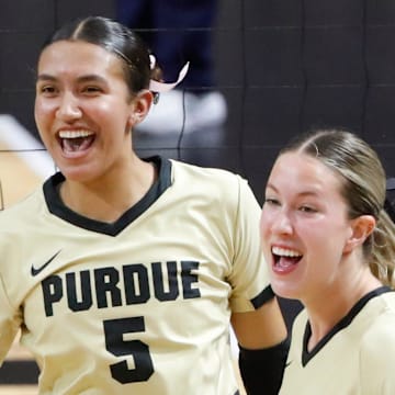 Purdue Boilermakers Setter Taylor Anderson (5) and outside hitter Kenna Wollard (4) celebrate 
