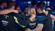 Professional Esports players are gathered around for a pep talk prior to competing in 2024.