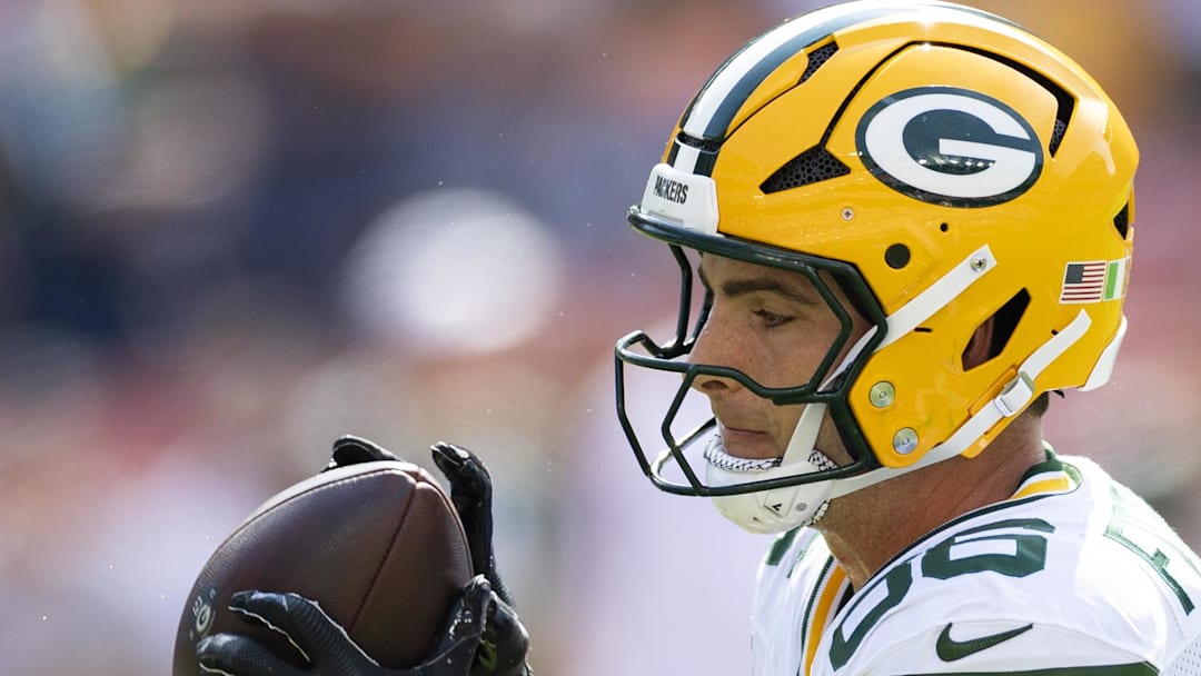 Green Bay Packers tight end John FitzPatrick catches the ball during warm ups before the game against the Cleveland Browns.
