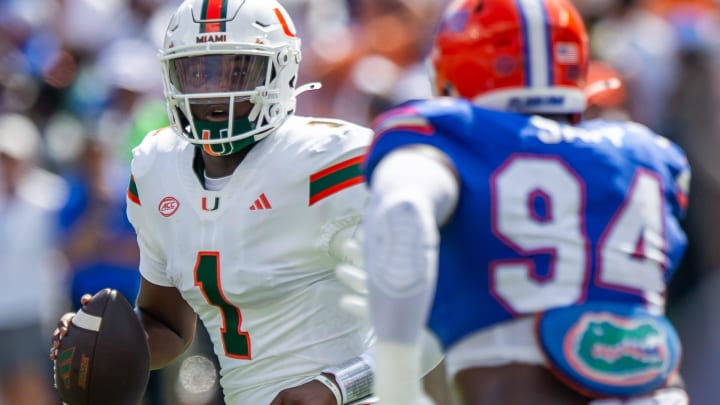 Florida defensive end Tyreak Sapp (94) pressures Miami Hurricanes quarterback Cam Ward (1) during the season opener at Ben Hill Griffin Stadium in Gainesville, FL on Saturday, August 31, 2024 against the University of Miami Hurricanes in the first half. [Doug Engle/Gainesville Sun]