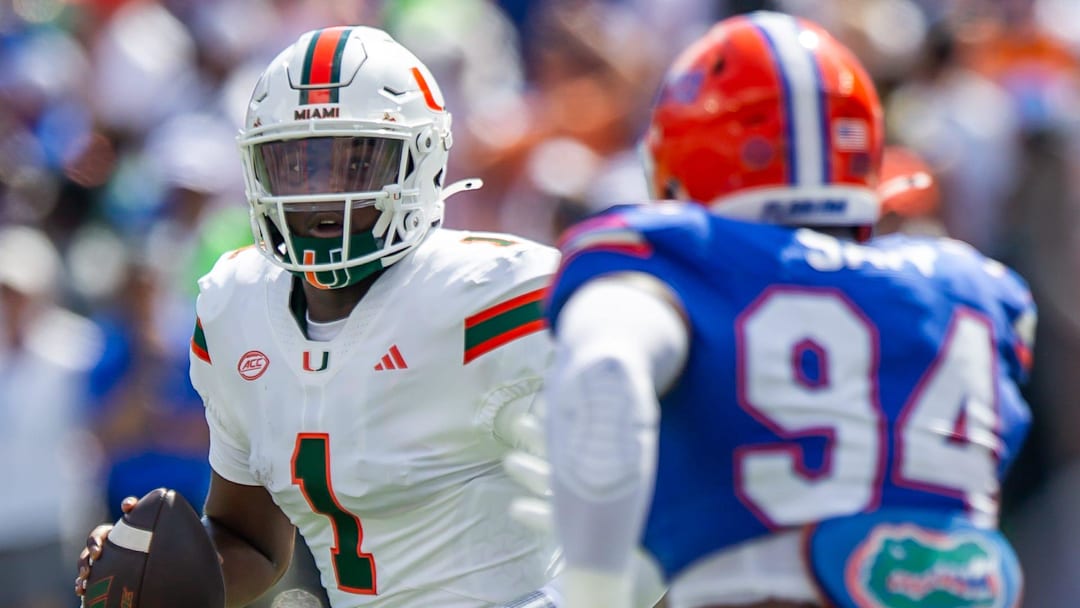 Florida defensive end Tyreak Sapp (94) pressures Miami Hurricanes quarterback Cam Ward (1) during the season opener at Ben Hill Griffin Stadium in Gainesville, FL on Saturday, August 31, 2024 against the University of Miami Hurricanes in the first half. [Doug Engle/Gainesville Sun]