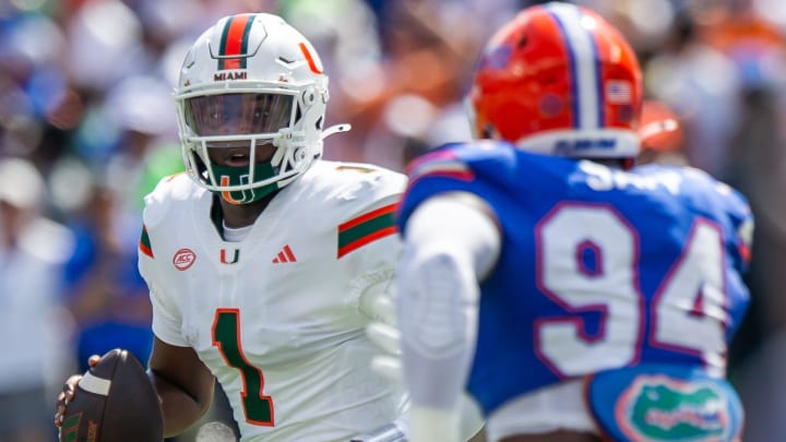 Florida defensive end Tyreak Sapp (94) pressures Miami Hurricanes quarterback Cam Ward (1) during the season opener at Ben Hill Griffin Stadium in Gainesville, FL on Saturday, August 31, 2024 against the University of Miami Hurricanes in the first half. [Doug Engle/Gainesville Sun]