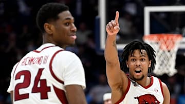 Arkansas guard D.J. Wagner (21) reacts after forward Billy Richmond III (24) scored a 3-point basket against South Carolina during a NCAA college basketball first round game at the men’s Southeastern Conference Tournament Wednesday, March 12, 2025, in Nashville, Tenn. Arkansas won 72-68.