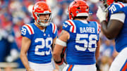 Gators kicker Trey Smack (29) reacts with Florida Gators offensive lineman Austin Barber (58) after making a 54-yard field goal against the Mississippi State Bulldogs during the first half at Ben Hill Griffin Stadium. 