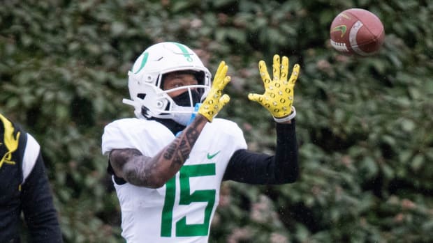 Oregon wide receiver Tez Johnson catches a pass during practice at the Hatfield-Dowlin Complex in Eugene.