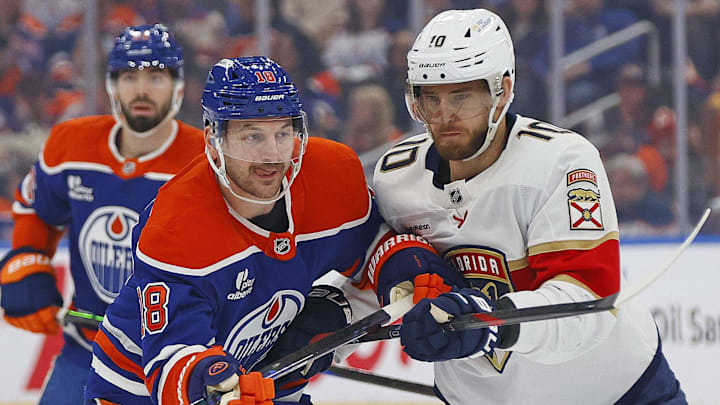 Mar 19, 2026; Edmonton, Alberta, CAN; Edmonton Oilers forward Zach Hyman (18) battles with Florida Panthers forward A.J. Greer (10) during the first period at Rogers Place. Mandatory Credit: Perry Nelson-Imagn Images