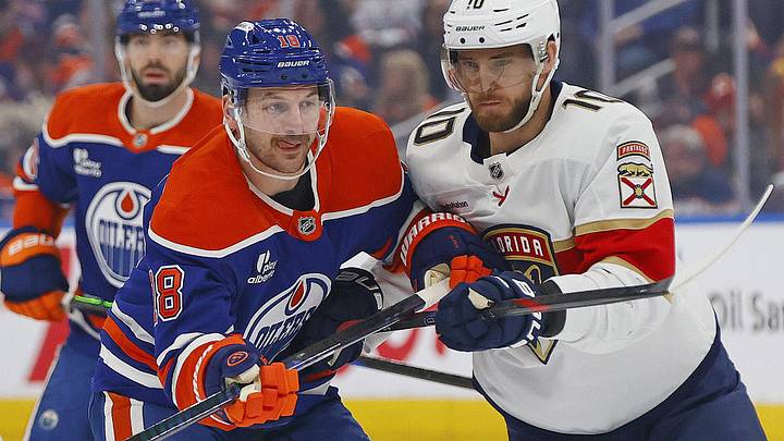 Mar 19, 2026; Edmonton, Alberta, CAN; Edmonton Oilers forward Zach Hyman (18) battles with Florida Panthers forward A.J. Greer (10) during the first period at Rogers Place. Mandatory Credit: Perry Nelson-Imagn Images