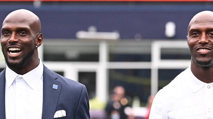 August 8, 2024; Foxborough, MA, USA;  Former New England Patriots defensive players Jason McCourty (l) and twin brother Devin McCourty (r) walk the sideline before a game against the Carolina Panthers at Gillette Stadium. Mandatory Credit: Eric Canha-Imagn Images