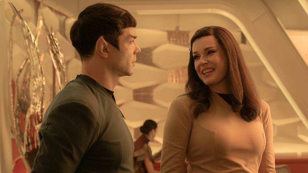 L to R Ethan Peck as Spock, Rebecca Romijn as Una and Patton Oswalt as Doug in season 3 , Episode 8 of Strange New Worlds streaming on Paramount+. Photo Credit: Marni GrossmanParamount+