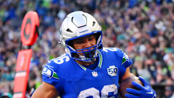 Seattle Seahawks running back Zach Charbonnet scores a touchdown during the second half against the Minnesota Vikings.
