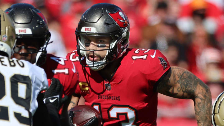 Dec 31, 2023; Tampa, Florida, USA; Tampa Bay Buccaneers wide receiver Mike Evans (13) runs with the ball against the New Orleans Saints during the first half at Raymond James Stadium.