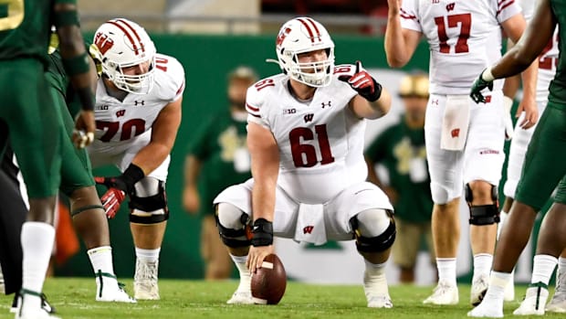 Wisconsin Badgers offensive lineman Tyler Biadasz (61) looks to snap the ball