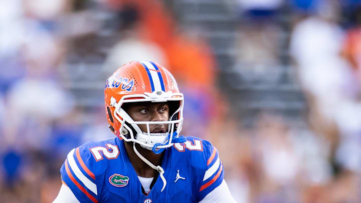 Aug 31, 2024; Gainesville, Florida, USA; Florida Gators quarterback DJ Lagway (2) rolls out to throw against the Miami Hurricanes during the second half at Ben Hill Griffin Stadium. Mandatory Credit: Matt Pendleton-Imagn Images