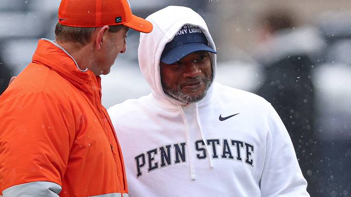 Dec 27, 2025; Bronx, NY, USA; Clemson Tigers head coach Dabo Swinney, left, talks with Penn State Nittany Lions interim head coach Terry Smith before the 2025 Pinstripe Bowl at Yankee Stadium. Mandatory Credit: Vincent Carchietta-Imagn Images