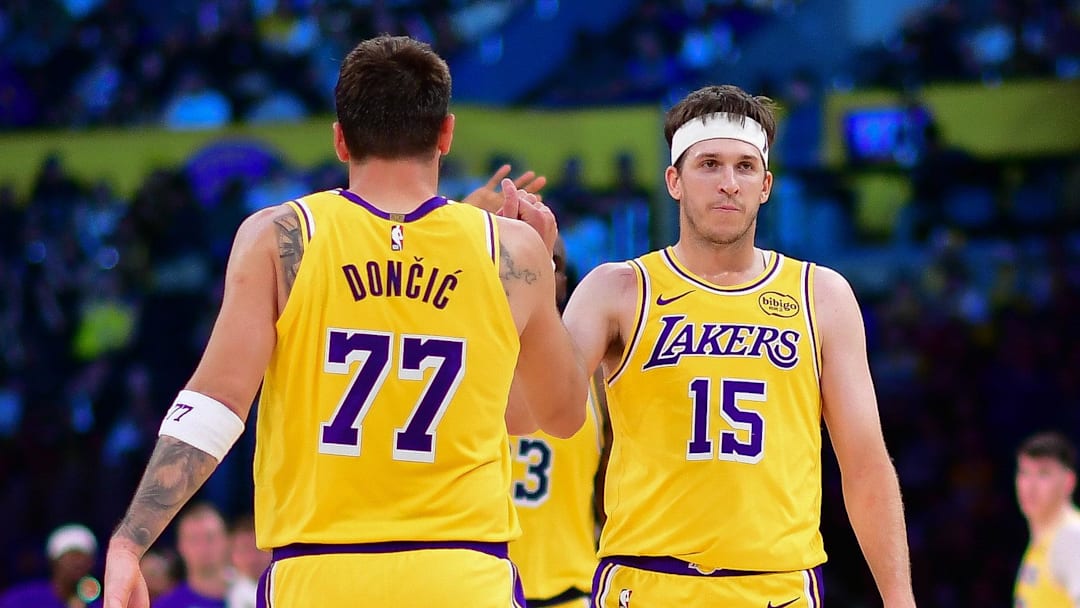 Mar 12, 2026; Los Angeles, California, USA; Los Angeles Lakers guard Luka Doncic (77) and guard Austin Reaves (15) react during the second half at Crypto.com Arena. Mandatory Credit: Gary A. Vasquez-Imagn Images