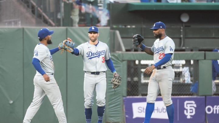 Jun 29, 2024; San Francisco, California, USA; Los Angeles Dodgers catcher Will Smith (16) and outfielder Chris Taylor (3) and outfielder Jason Heyward (23) celebrate after defeating the San Francisco Giants at Oracle Park. Mandatory Credit: Ed Szczepanski-USA TODAY Sports