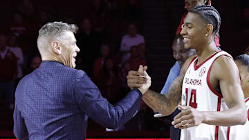 Oklahoma forward Jalon Moore and head coach Porter Moser