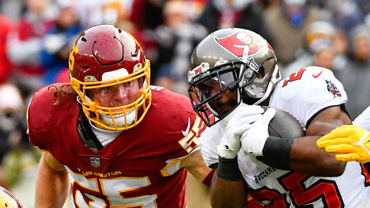 Nov 14, 2021; Landover, Maryland, USA; Tampa Bay Buccaneers running back Giovani Bernard (25) is tackled by Washington Football Team defensive tackle Daron Payne (94) during the second half at FedExField. Mandatory Credit: Brad Mills-Imagn Images