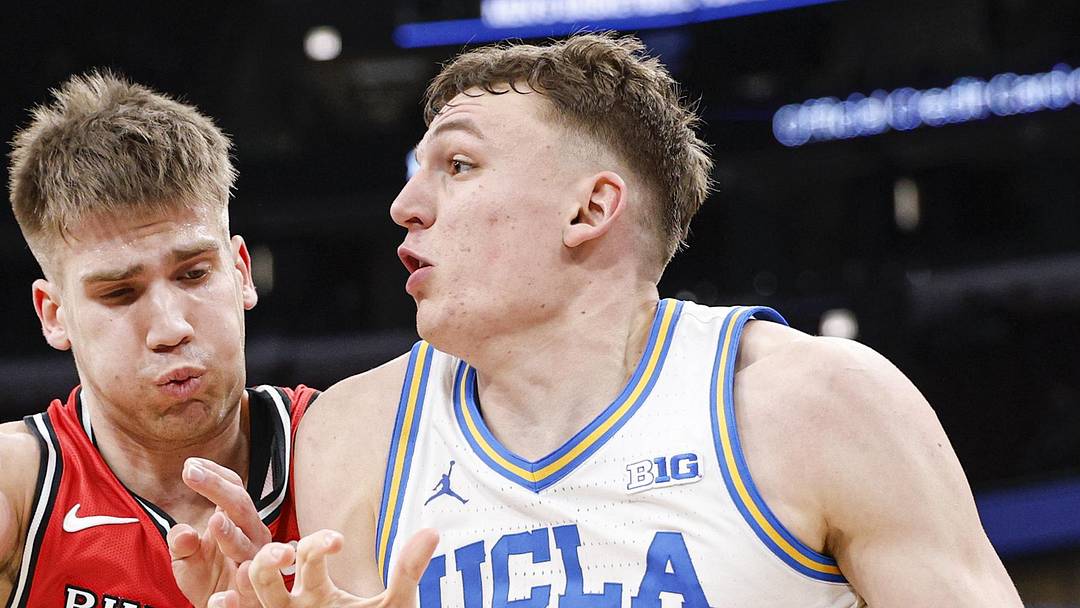 Mar 12, 2026; Chicago, IL, USA; UCLA Bruins forward Tyler Bilodeau (34) drives to the basket against Rutgers Scarlet Knights guard Harun Zrno (13) during the second half at United Center. Mandatory Credit: Kamil Krzaczynski-Imagn Images