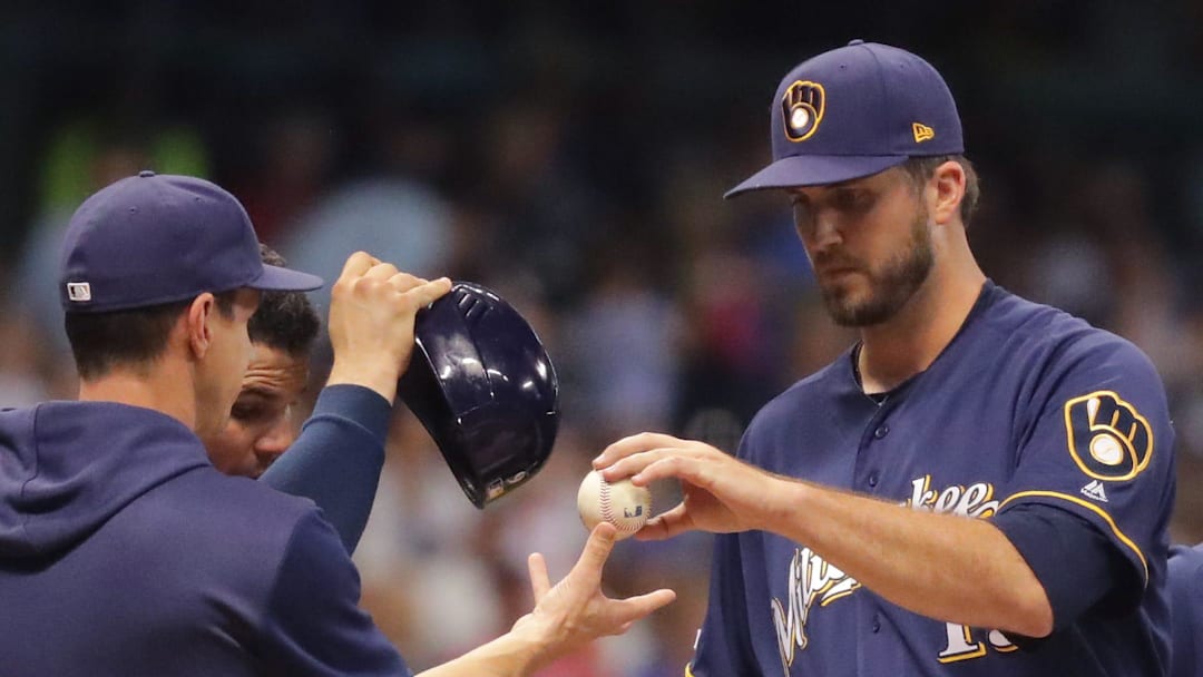 Milwaukee Brewers pitcher Drew Pomeranz hands the ball to manager Craig Counsell  after being pulled during the eighth inning of their game  against the MinnesotaTwins Tuesday, August 13, 2019 at Miller Park in Milwaukee, Wis.



MARK HOFFMAN/MILWAUKEE JOURNAL SENTINEL

Mjs Brewers14 23 Hoffman Jpg Dairy Veterinarian
