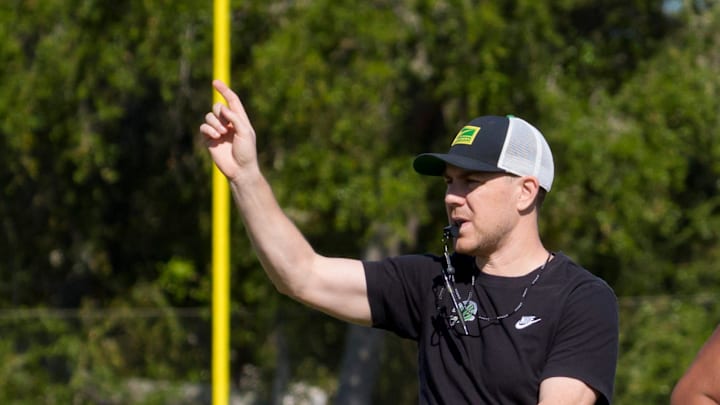Oregon offensive coordinator Will Stein walks the field as the Oregon Ducks practice at Barry University ahead of the Orange Bowl on Dec. 30, 2025, in Miami, Florida.