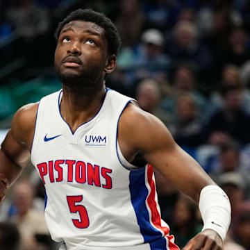 Apr 12, 2024; Dallas, Texas, USA; Dallas Mavericks forward Olivier-Maxence Prosper (18) and Detroit Pistons forward Chimezie Metu (5) battle for position during the first half at American Airlines Center. Mandatory Credit: Chris Jones-Imagn Images