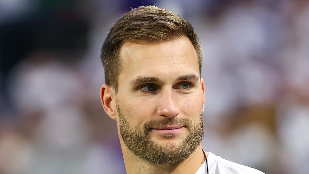 Former Minnesota Vikings quarterback Kirk Cousins looks on from the bench during the second quarter against the Detroit Lions.
