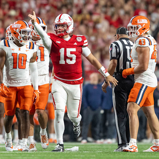 Nebraska quarterback Dylan Raiola signals a first down after gaining three yards on a 3rd-and-1 against Illinois.