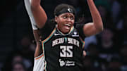 Sep 17, 2025; Brooklyn, New York, USA; New York Liberty center Jonquel Jones (35) grabs an entry pass against the Phoenix Mercury during game two of round one for the 2025 WNBA Playoffs at Barclays Center. Mandatory Credit: Wendell Cruz-Imagn Images