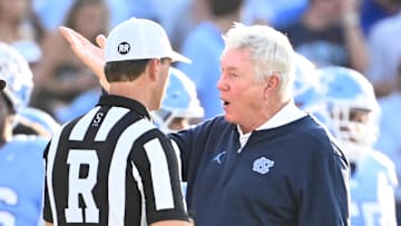 Sep 7, 2024; Chapel Hill, North Carolina, USA; North Carolina Tar Heels head coach Mack Brown with the referee in the third quarter at Kenan Memorial Stadium.