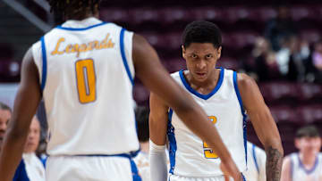 Lincoln Park's Meleek Thomas reacts after a scoring run forces Archbishop Carroll to call a timeout during the PIAA Class 4A Boys Basketball Championship at the Giant Center on March 21, 2024, in Hershey. The Leopards won, 80-50, to claim back-to-back titles.