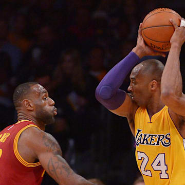 Mar 10, 2016; Los Angeles, CA, USA; Cleveland Cavaliers forward LeBron James (23) guards Los Angeles Lakers forward Kobe Bryant (24) in the first quarter of the game at Staples Center. Mandatory Credit: Jayne Kamin-Oncea-Imagn Images