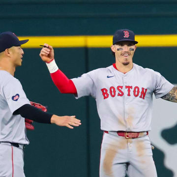 Aug 4, 2024; Arlington, Texas, USA; Boston Red Sox center fielder Jarren Duran (16) celebrates with Boston Red Sox left fielder Rob Refsnyder (30) after the game against the Texas Rangers at Globe Life Field.