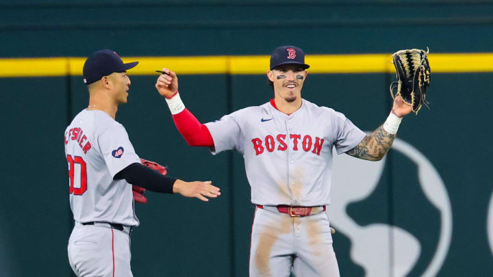 Aug 4, 2024; Arlington, Texas, USA; Boston Red Sox center fielder Jarren Duran (16) celebrates with Boston Red Sox left fielder Rob Refsnyder (30) after the game against the Texas Rangers at Globe Life Field.