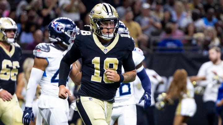 Aug 25, 2024; New Orleans, Louisiana, USA;  New Orleans Saints quarterback Spencer Rattler (18) reacts to passing a touchdown against the Tennessee Titans during the first half at Caesars Superdome. Mandatory Credit: Stephen Lew-USA TODAY Sports