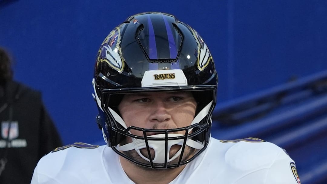 Sep 7, 2025; Orchard Park, New York, USA;  Baltimore Ravens center Tyler Linderbaum (64) and center Corey Bullock (67) enter the field for warm up prior to the game against the Buffalo Bills at Highmark Stadium. Mandatory Credit: Gregory Fisher-Imagn Images