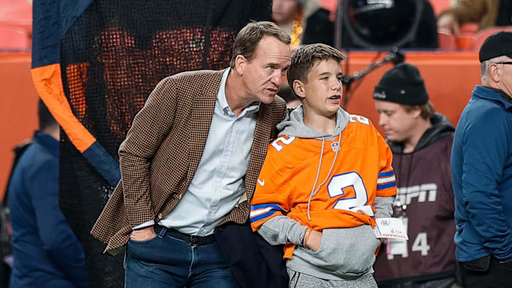 Dec 2, 2024; Denver, Colorado, USA; Former Denver Broncos player Peyton Manning with his son Marshall before the game against the Cleveland Browns at Empower Field at Mile High. Mandatory Credit: Isaiah J. Downing-Imagn Images