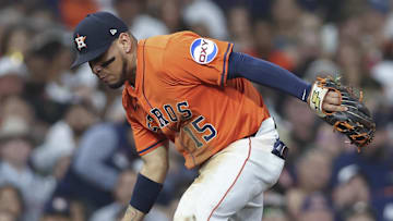 Jul 11, 2025; Houston, Texas, USA; Houston Astros third baseman Isaac Paredes (15) is unable to make a play on a ground ball during the fifth inning against the Texas Rangers at Daikin Park. 