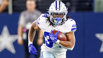 Dallas Cowboys running back Jaydon Blue (34) carries the ball during the fourth quarter against the Atlanta Falcons at AT&T Stadium.