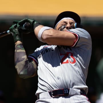 Jun 22, 2024; Oakland, California, USA; Minnesota Twins designated hitter Royce Lewis (23) ducks away from a high and tight pitch from Oakland Athletics pitcher Osvaldo Bido during the third inning at Oakland-Alameda County Coliseum. Mandatory Credit: D. Ross Cameron-USA TODAY Sports