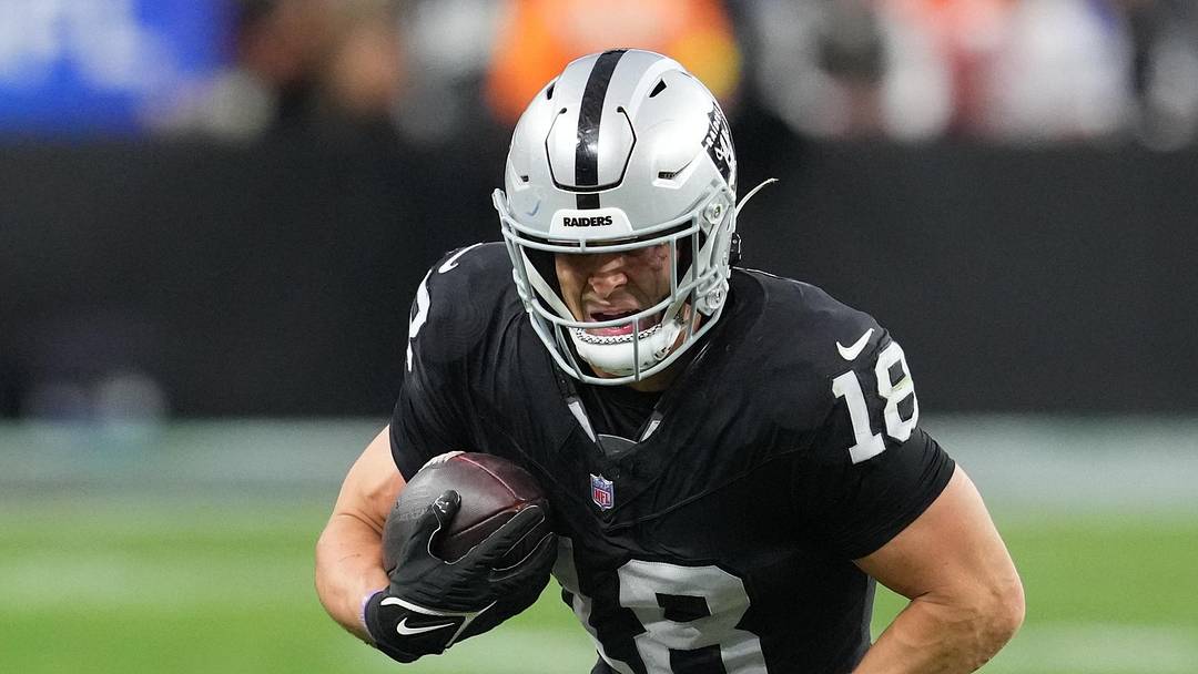 Dec 7, 2025; Paradise, Nevada, USA;  Las Vegas Raiders wide receiver Jack Bech (18) runs after the catch against the Denver Broncos during the second half at Allegiant Stadium. Mandatory Credit: Stephen R. Sylvanie-Imagn Images