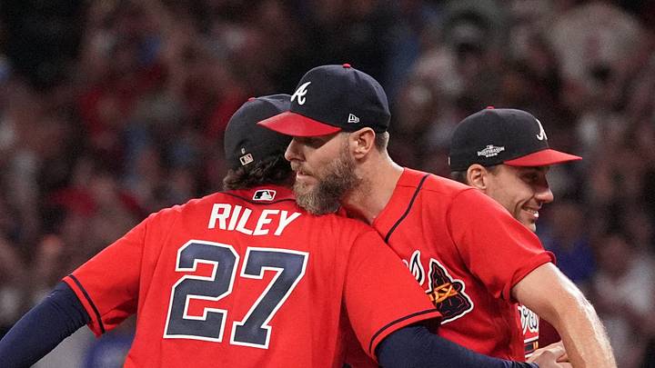 Oct 1, 2026; Cumberland, Georgia, USA;  Atlanta Braves pitcher Chris Sale (51) celebrates with infielder Austin Riley (27) after defeating the Philadelphia Phillies in game three of the Wildcard round for the 2026 MLB Playoffs at Truist Field.  Mandatory Credit: Dale Zanine-Imagn Images