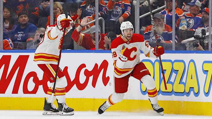 Oct 13, 2024; Edmonton, Alberta, CAN; The Calgary Flames celebrate a goal scored by forward Justin Kirkland (58) during the third period against the Edmonton Oilers at Rogers Place. Mandatory Credit: Perry Nelson-Imagn Images Oct 13, 2024; Edmonton, Alberta, CAN; The Calgary Flames celebrate a goal scored by forward Justin Kirkland (58) during the third period against the Edmonton Oilers at Rogers Place. Mandatory Credit: Perry Nelson-Imagn Images
