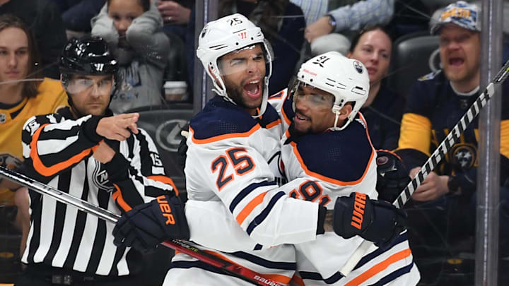 Edmonton Oilers defenseman Darnell Nurse (25) and left wing Evander Kane (91) celebrate after a goa