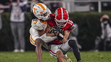 Nov 16, 2024; Athens, Georgia, USA; Georgia Bulldogs wide receiver London Humphreys (16) is tackled by Tennessee Volunteers defensive back Jermod McCoy (3) after a catch during the second half at Sanford Stadium. Mandatory Credit: Dale Zanine-Imagn Images