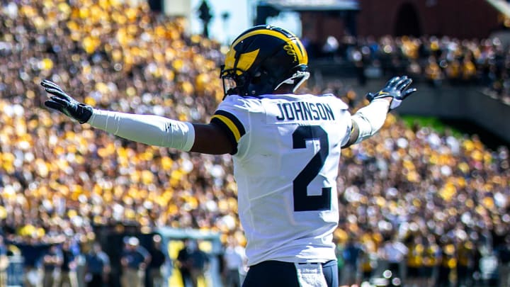 Iowa tight end Sam LaPorta (84) and Michigan defensive back Will Johnson (2) react as a penalty is called on Iowa during a NCAA Big Ten Conference college football game, Saturday, Oct. 1, 2022, at Kinnick Stadium in Iowa City, Iowa.